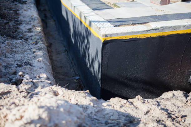 Professional Waterproofing technician working in North Webster, IN
